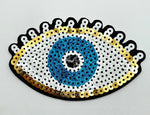 Parche ojo dorado